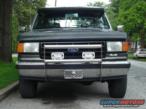 Gray Ford Bronco front view with chrome grille guard and Hella lights