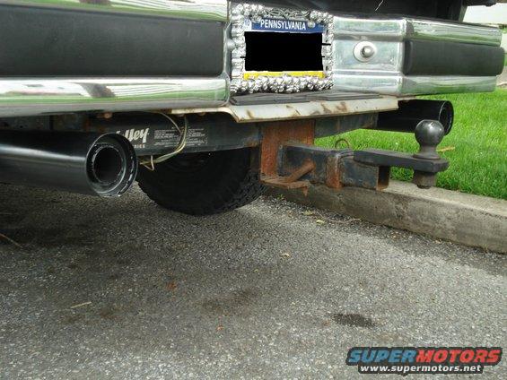 Rear bumper, hitch, and dual exhaust pipes of a truck with a Pennsylvania license plate