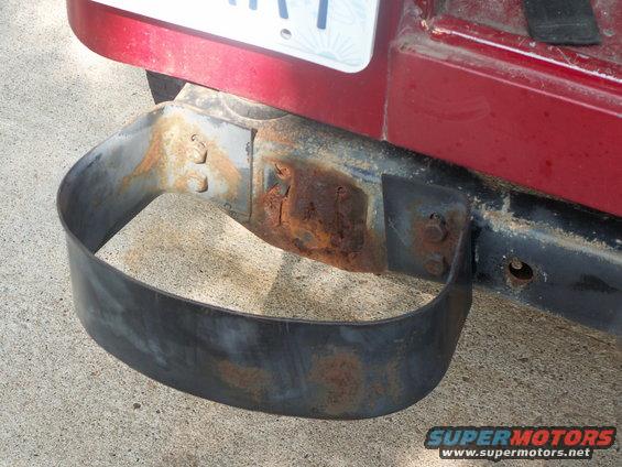 rear bumper step with rust on mounting bracket