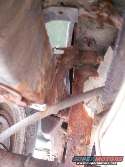 rusted frame and suspension components of a vehicle