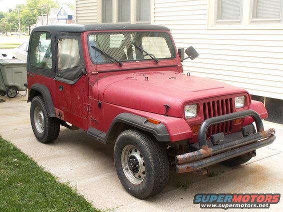 Red 1988 Jeep YJ with black soft top and bull bar