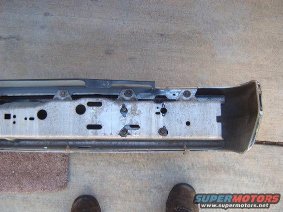 Car bumper assembly with mounting brackets and chrome end cap