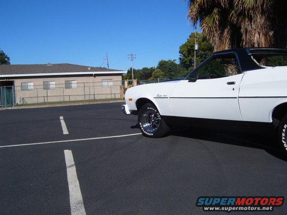 White 1973 Ford Ranchero side view with black trim and vinyl roof