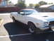1973 Ford Ranchero - White 1973 Ford Ranchero with black vinyl top and hood scoop.
