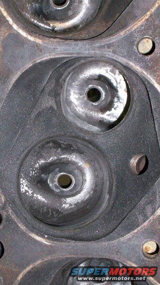 Close-up of an engine cylinder head with two valve openings