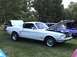 1968 Ford Mustang - A white 1968 Ford Mustang is displayed with its hood and trunk open at an outdoor car show.