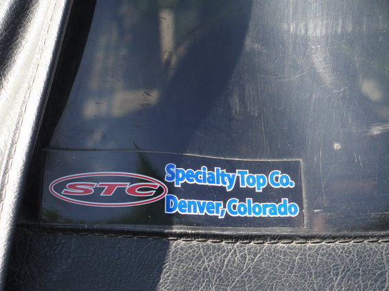 STC Specialty Top Co. Denver, Colorado sticker on black soft top material