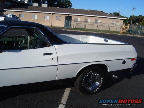1973 Ford Ranchero side view, white with black top and bed cover