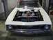 1969 Mercury Cyclone - This classic car, possibly a 1969 Mercury Cyclone, is shown with its hood open, revealing the engine and various components.