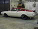 1969 Mercury Cyclone - This 1969 Mercury Cyclone coupe is shown in a garage with a two-tone paint scheme and a spoiler.