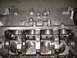 1956 Ford Crown Victoria - Close-up view of an engine block's crankshaft bearing saddles, revealing internal mechanical components.