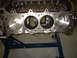 1956 Ford Crown Victoria - Engine block with pistons visible, mounted on a stand for repair or inspection.