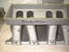 1956 Ford Crown Victoria - Close-up of a Trick Flow intake manifold, a performance automotive part.