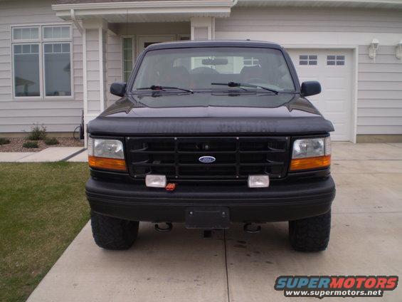 Black 1996 Ford Bronco front view with aftermarket grille lights