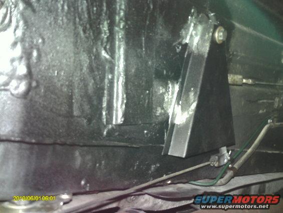 under car parking brake cable shield was missing, replaced and sprayed with truck bed liner