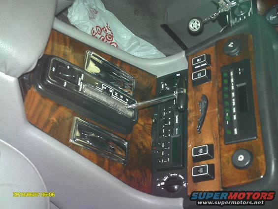 After re-gluing the peeling wood and refinishing with Helmsman Spar Urethane gloss. Very tedious process of gluing and clamping small sections of the wood at a time. Also reglued and refinished the wood around trip computer.