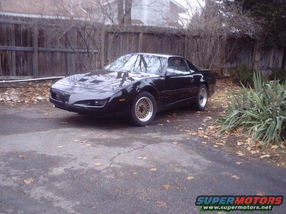 Black 1991 Pontiac Firebird parked in driveway
