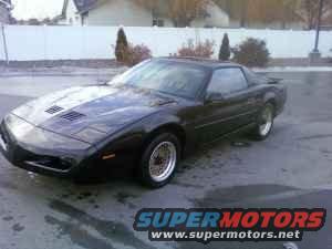 1991 Pontiac Firebird coupe, black paint, aftermarket wheels