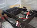 1984 Ford Bronco - The frame of a vehicle, likely from the 1980s, is shown with its fuel tank and suspension components.