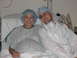 2001 Pontiac Trans Am - A pregnant woman and a man in a hospital room, both wearing surgical caps and gowns.