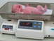 2001 Pontiac Trans Am - A newborn baby is weighed on an Olympic Smart Scale, displaying a weight of 7.07.