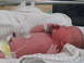 2001 Pontiac Trans Am - A newborn baby is shown with a hospital identification bracelet and medical monitoring equipment attached.