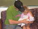 2001 Pontiac Trans Am - A father and older sister cradle a newborn baby.