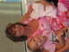 2001 Pontiac Trans Am - Woman with a baby and a young girl, indoors.
