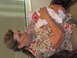 2001 Pontiac Trans Am - A grandmother lovingly cradles her newborn grandchild.