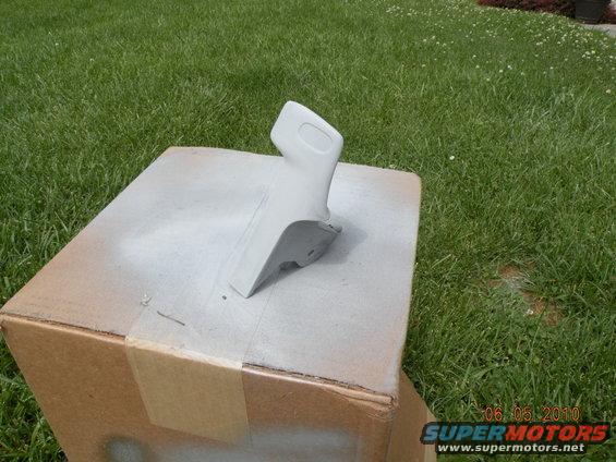 Gray interior trim piece on cardboard box