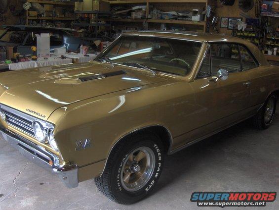 Gold 1967 Chevrolet Chevelle SS coupe in a garage