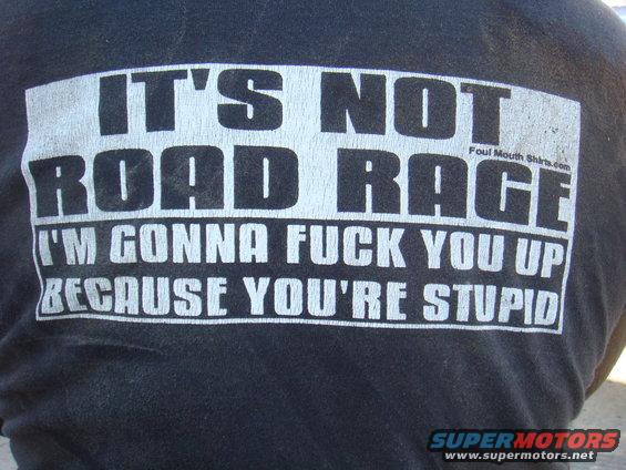 Black t-shirt with white text: 'IT'S NOT ROAD RAGE I'M GONNA FUCK YOU UP BECAUSE YOU'RE STUPID'. Foul Mouth Shirts.com and SUPERMOTORS.NET logos visible