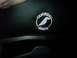 1995 Ford Bronco - A circular patch with the Corbeau Seats logo is visible on dark material, possibly a car seat.