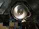 1985 Ford Mustang - Underneath view of a vehicle's flywheel and transmission bell housing, likely during maintenance.