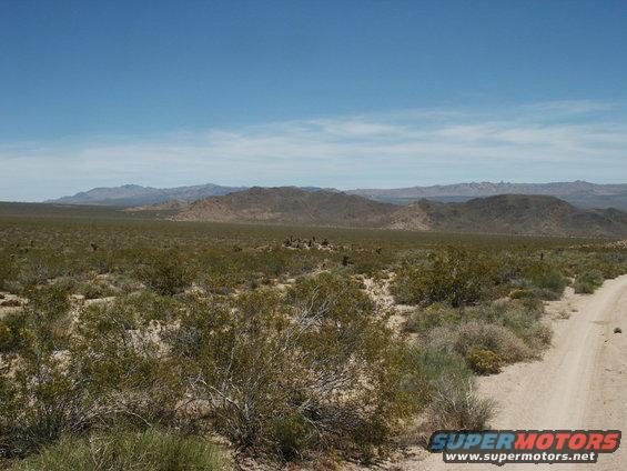 pict0335.jpg looking back to a "camp" location along the road.  Way back at the base of the hill in the background.