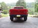 1997 Ford Ranger - Rear view of a red 1997 Ford Ranger pickup truck parked on a driveway.