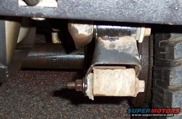 dcp_1128.jpg The stock shackles really aren't up to the task.  My passenger side bent (altho you can see my spring bushing was hurting, too)