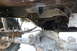 1984 Ford Bronco II - Undercarriage view of a 1984 Ford Bronco II, highlighting the rear differential and suspension components.