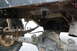 1984 Ford Bronco II - Close-up of the rear axle and suspension of an off-road vehicle.