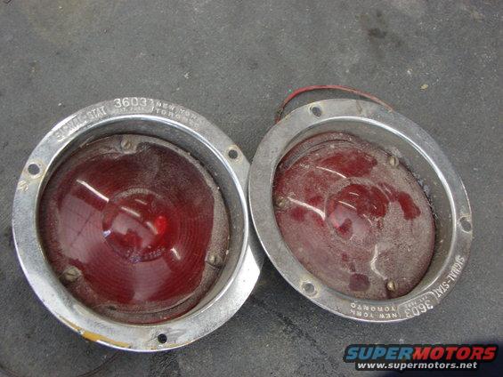 Two Signal-Stat 3603 taillight assemblies with red lenses and chrome bezels on a dark surface