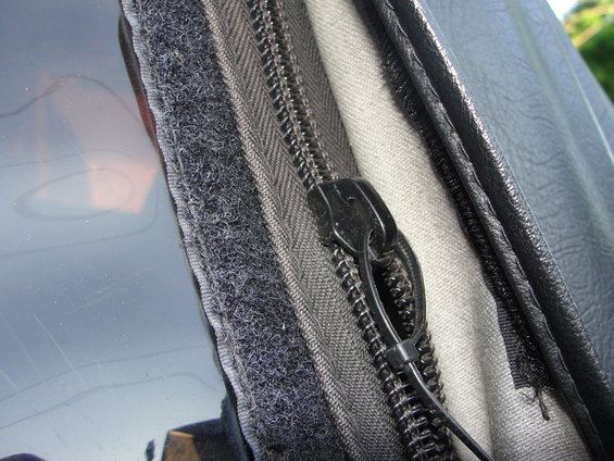 Close-up of a zipper and velcro on a vehicle's soft top