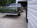 1970 Ford Ranchero - Green 1970 Ford Ranchero parked in a driveway next to a garage.