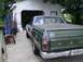 1970 Ford Ranchero - The rear view of a green 1970 Ford Ranchero shows its tailgate and chrome bumper.