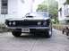 1970 Ford Ranchero - This 1970 Ford Ranchero is presented from a low front angle, highlighting its grille and hood scoop.
