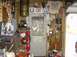 1970 Ford Ranchero - A cluttered garage scene features an air compressor, tool chest, and various wall decorations including Budweiser and Route 66 signs.