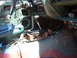 1973 Ford Ranchero - The interior of a vehicle is shown with parts disassembled, revealing wiring and the central console area.
