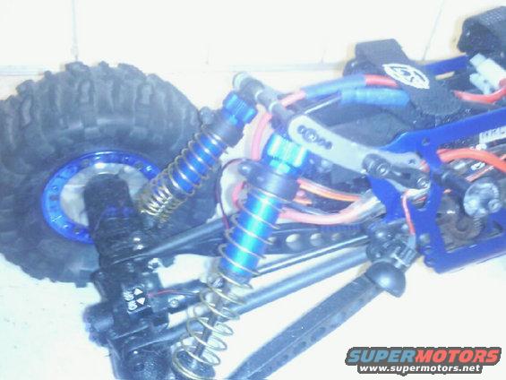 photo0331.jpg Added the adjustable, extended upper c/o brackets, front and rear. Also added extended, softer rate coils.