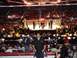 1996 Ford Bronco - A crowd watches a mixed martial arts fight in a packed arena with a fighter in the foreground.