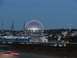 1996 Ford Bronco - A wide shot captures a geodesic dome stadium illuminated at dusk, with the city skyline and a construction crane visible in the background.