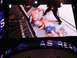 1996 Ford Bronco - A mixed martial arts match is underway inside a cage with a referee present.